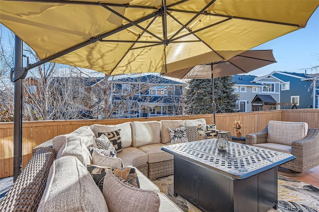 view of patio / terrace featuring outdoor lounge area and fence