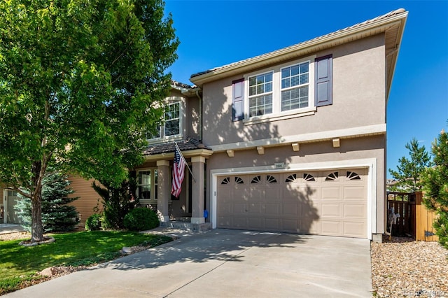 3505 Dinosaur St, Castle Rock, CO 80109 - traditional home featuring an attached garage, stucco siding, driveway, and a tiled roof