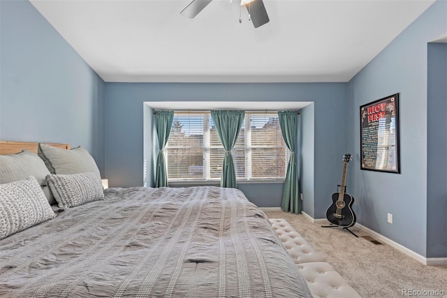 bedroom featuring ceiling fan and light colored carpet