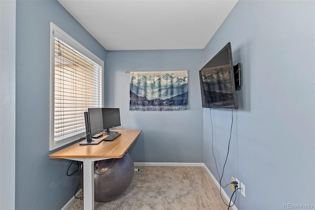 office space with a wealth of natural light and light carpet