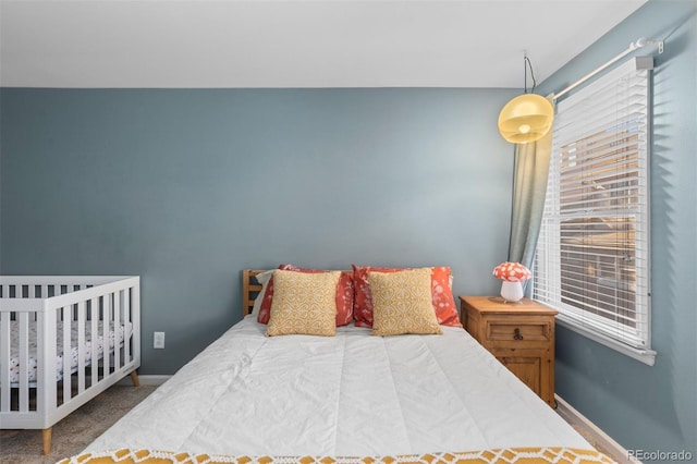 bedroom featuring carpet floors and multiple windows