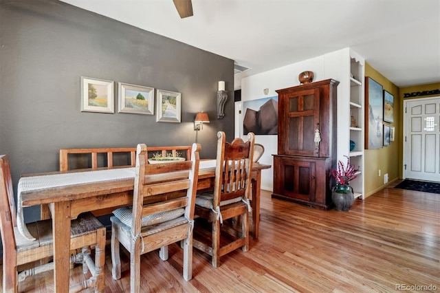 dining area with light hardwood / wood-style flooring