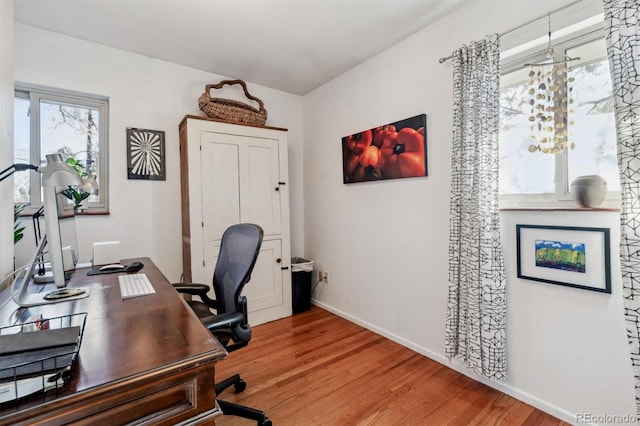 office space with light hardwood / wood-style floors