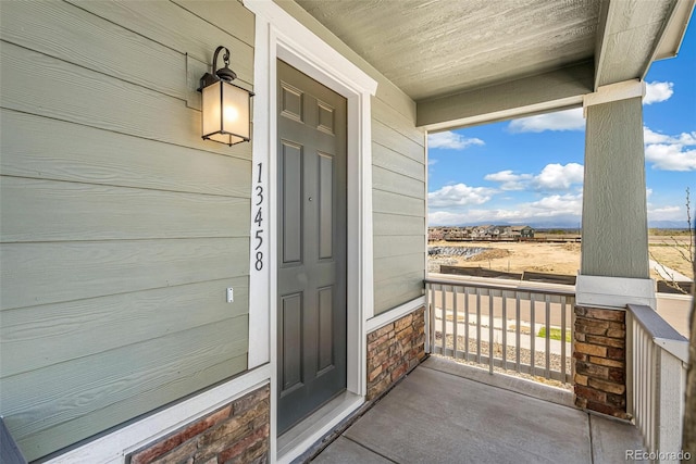 13458 E 111th Ave, Commerce City, CO 80022 - property entrance featuring covered porch