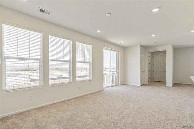 13458 E 111th Ave, Commerce City, CO 80022 - spare room featuring light carpet, recessed lighting, and baseboards