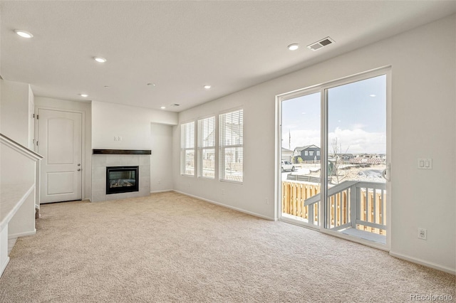 13458 E 111th Ave, Commerce City, CO 80022 - unfurnished living room with carpet floors, recessed lighting, baseboards, and a tiled fireplace
