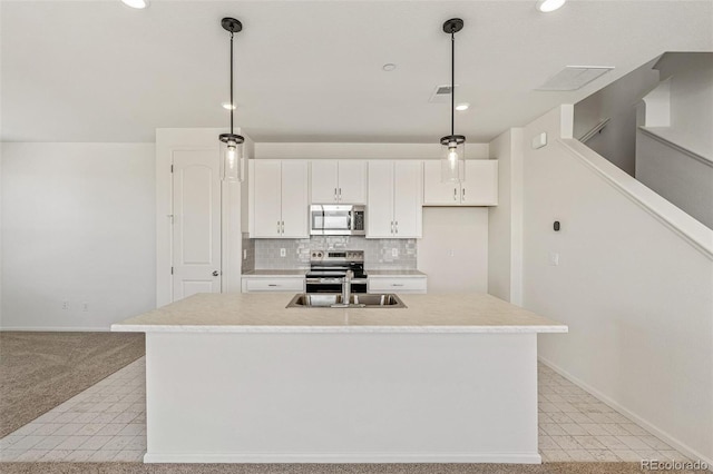 13458 E 111th Ave, Commerce City, CO 80022 - kitchen featuring stainless steel appliances, a sink, white cabinets, baseboards, and light countertops