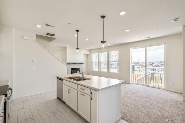13458 E 111th Ave, Commerce City, CO 80022 - kitchen featuring stainless steel appliances, a sink, open floor plan, a fireplace, and white cabinetry