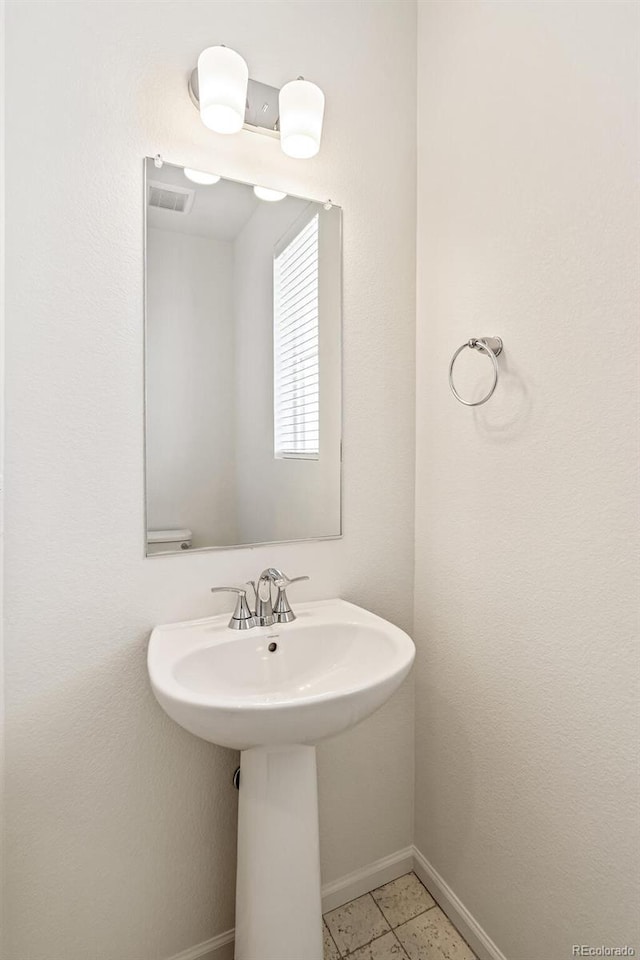 13458 E 111th Ave, Commerce City, CO 80022 - bathroom featuring baseboards