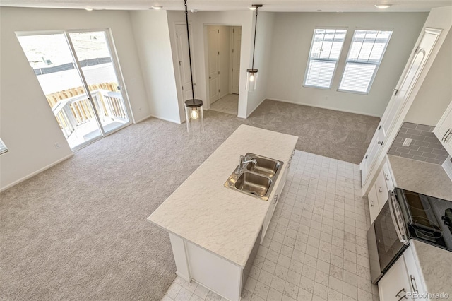 13458 E 111th Ave, Commerce City, CO 80022 - kitchen with light carpet, a sink, range with electric cooktop, light countertops, and white cabinets