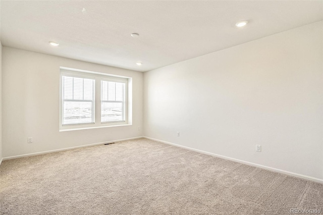 13458 E 111th Ave, Commerce City, CO 80022 - empty room featuring carpet flooring, baseboards, and recessed lighting