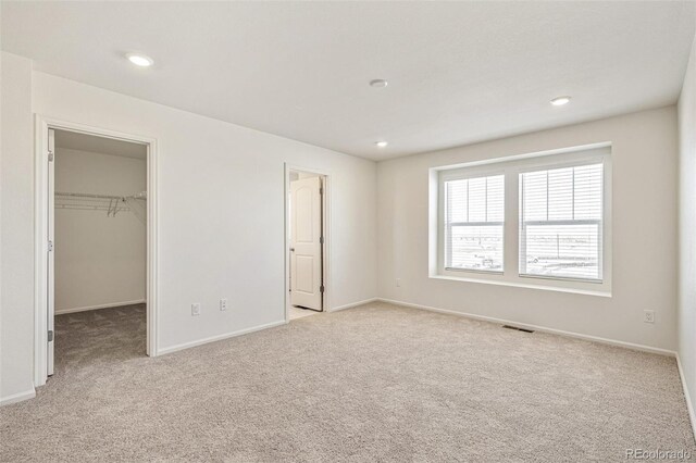 13458 E 111th Ave, Commerce City, CO 80022 - unfurnished bedroom with carpet flooring, a spacious closet, baseboards, and recessed lighting