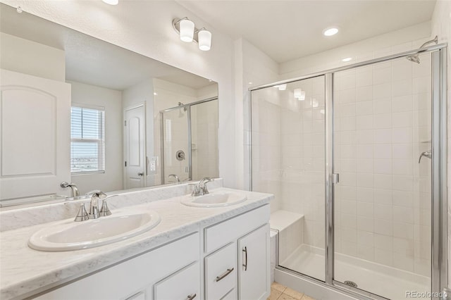 13458 E 111th Ave, Commerce City, CO 80022 - full bathroom with a stall shower, recessed lighting, double vanity, and tile patterned flooring