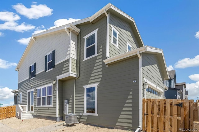 13458 E 111th Ave, Commerce City, CO 80022 - rear view of house featuring fence and central AC