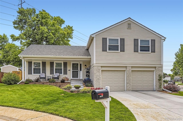 7465 S Ivy Way, Centennial, CO 80112 - tri-level home with a porch, a front lawn, driveway, and brick siding