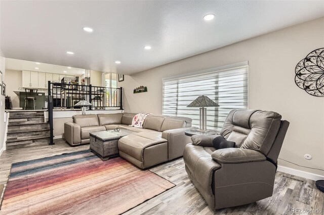 7465 S Ivy Way, Centennial, CO 80112 - living area with stairs, light wood-style floors, baseboards, and recessed lighting