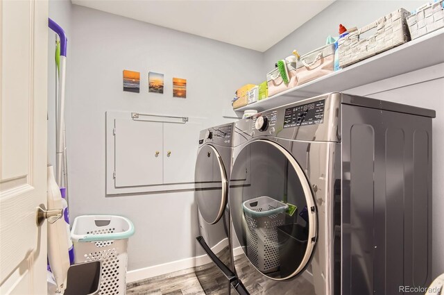 7465 S Ivy Way, Centennial, CO 80112 - laundry room with washing machine and dryer, wood finished floors, and baseboards