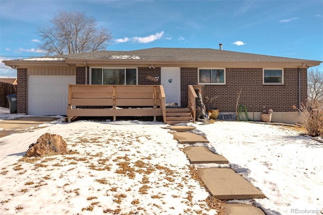 9486 Pelon Dr, Denver, CO 80260 - ranch-style home featuring brick siding, a garage, and a wooden deck