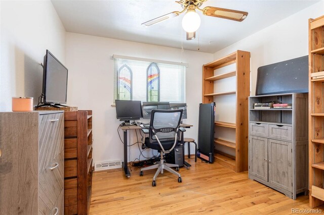 9486 Pelon Dr, Denver, CO 80260 - home office with a ceiling fan and light wood-style flooring