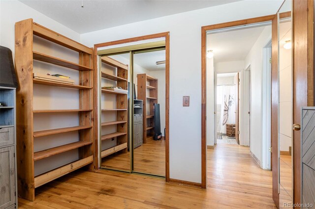 9486 Pelon Dr, Denver, CO 80260 - unfurnished bedroom featuring light wood finished floors, a closet, and baseboards