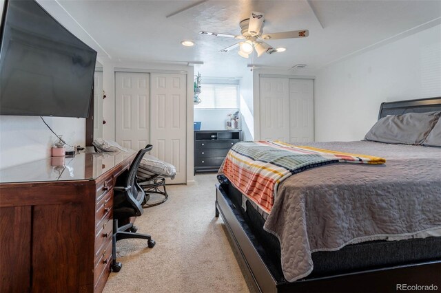 9486 Pelon Dr, Denver, CO 80260 - bedroom with two closets, light carpet, a ceiling fan, and an office area