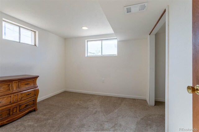 9486 Pelon Dr, Denver, CO 80260 - unfurnished bedroom featuring carpet flooring, multiple windows, and baseboards