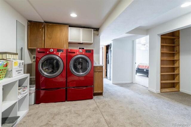 9486 Pelon Dr, Denver, CO 80260 - laundry area with cabinet space, independent washer and dryer, light colored carpet, recessed lighting, and baseboards