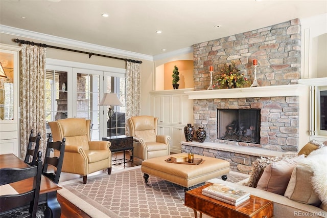 living room featuring wood finished floors, a fireplace, recessed lighting, and crown molding
