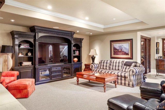 carpeted living area featuring recessed lighting, a raised ceiling, and crown molding