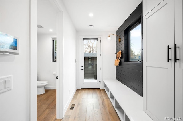 mudroom featuring baseboards, light wood finished floors, recessed lighting, and visible vents