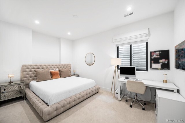 bedroom with light colored carpet, visible vents, baseboards, and recessed lighting