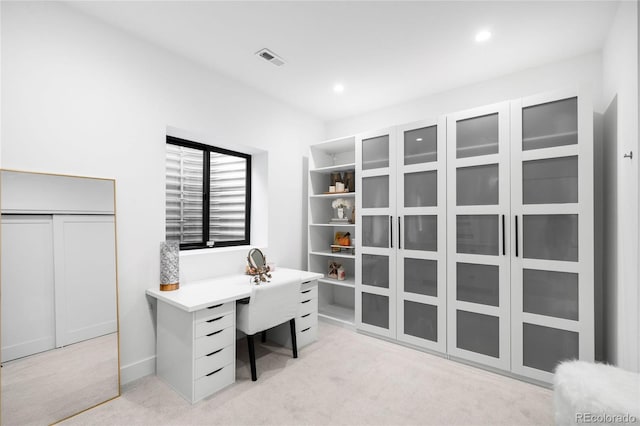 office featuring light carpet, baseboards, visible vents, and recessed lighting