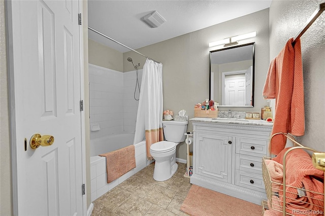 bathroom featuring toilet, vanity, shower / bath combination with curtain, and tile patterned floors