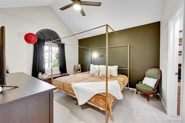 bedroom with light colored carpet, a ceiling fan, and high vaulted ceiling