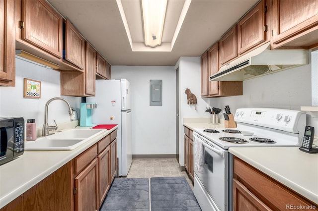 kitchen with white appliances, electric panel, and sink