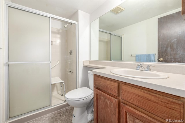 bathroom with walk in shower, vanity, and toilet