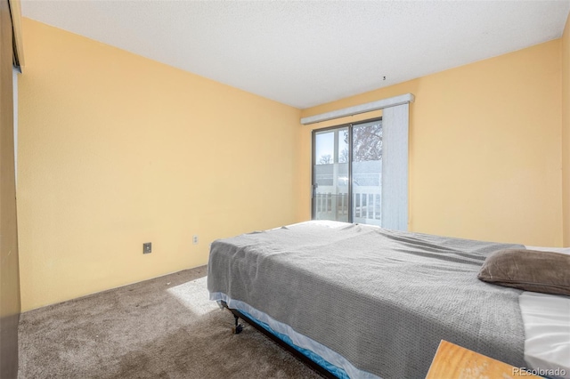 carpeted bedroom featuring access to exterior