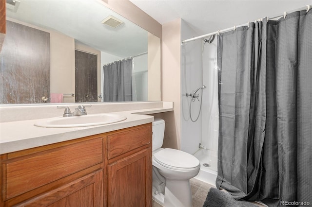 bathroom with vanity, a shower with curtain, and toilet