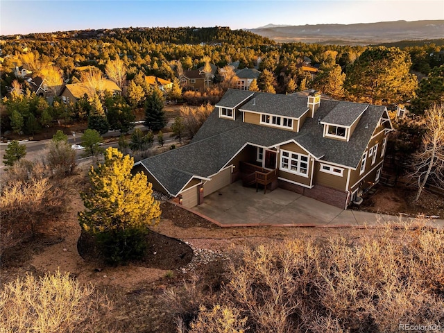 drone / aerial view with a view of trees