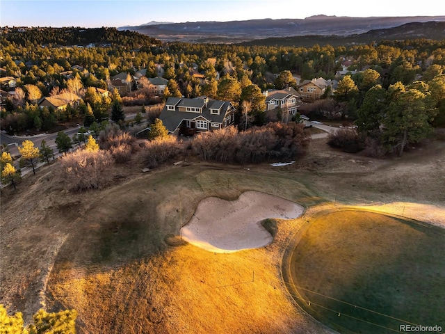birds eye view of property with a mountain view