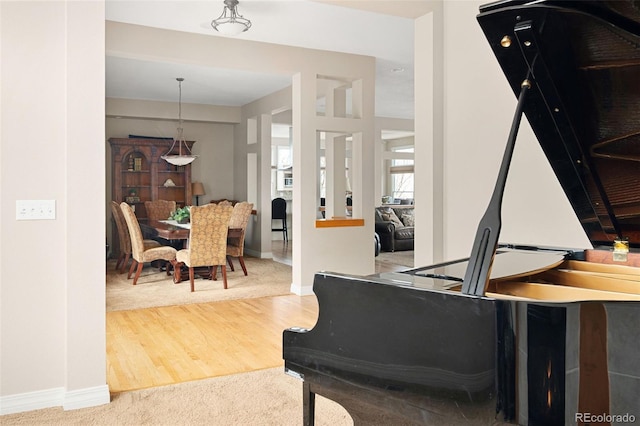 living room with baseboards and wood finished floors
