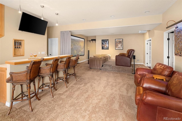 interior space with baseboards, light carpet, and a bar