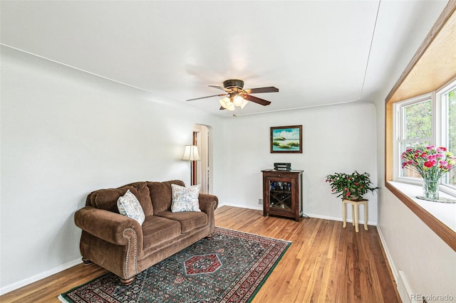 4285 Newland St, Wheat Ridge, CO 80033 - living area featuring wood finished floors, baseboards, and a ceiling fan