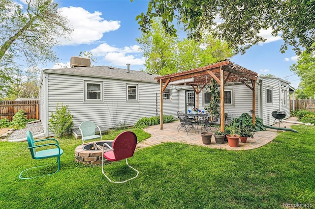 4285 Newland St, Wheat Ridge, CO 80033 - rear view of property featuring a fire pit, a pergola, a patio area, and central AC unit