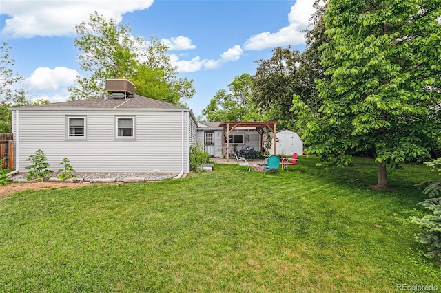 4285 Newland St, Wheat Ridge, CO 80033 - view of yard with a pergola, central AC, and a patio