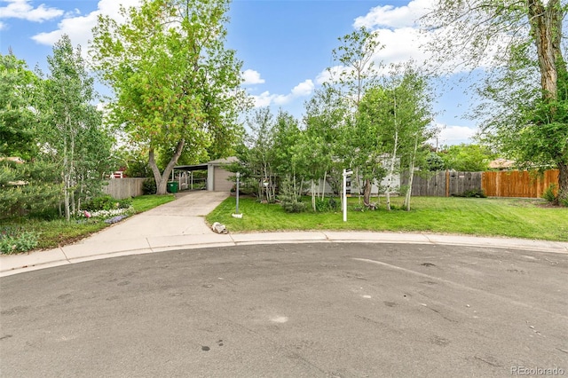 4285 Newland St, Wheat Ridge, CO 80033 - view of front of house featuring driveway and a garage