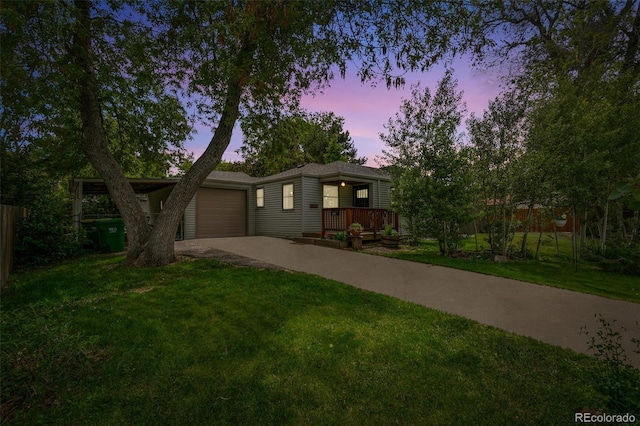 4285 Newland St, Wheat Ridge, CO 80033 - view of front facade featuring concrete driveway, an attached garage, and a porch