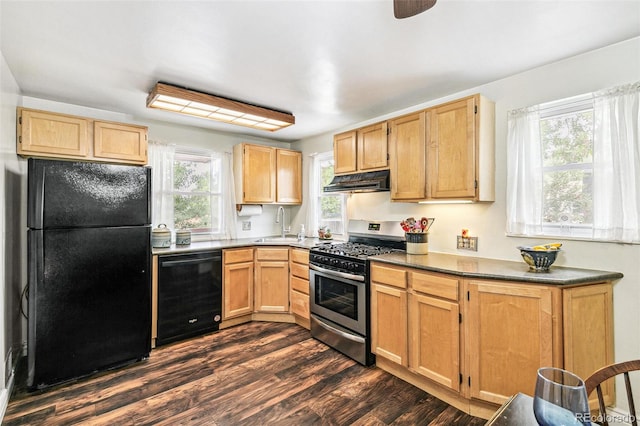 4285 Newland St, Wheat Ridge, CO 80033 - kitchen featuring black appliances, under cabinet range hood, a sink, dark wood-style flooring, and dark countertops