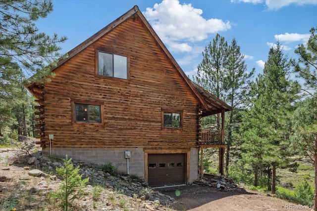 view of property exterior with a garage