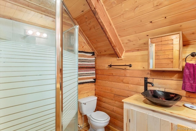 bathroom featuring lofted ceiling with beams, wooden walls, wood ceiling, and toilet